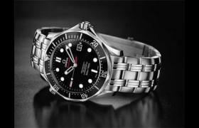 欧米茄表把头怎么拔出